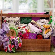 a wooden box filled with lots of different types of items on top of a table