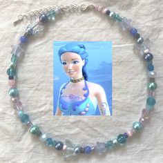 ❀ handmade with love <3 ❀ inspired by the character Nori from Barbie Fairytopia: Mermadia ପ(๑*ᴗ*๑)ଓ ♡ ❀ made with lilac purple, cobalt blue, navy blue, sky blue, periwinkle blue, rose pink, baby pink, turquoise, ocean blue, white glass and pearl beads