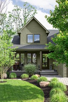 a house that is in the middle of some grass