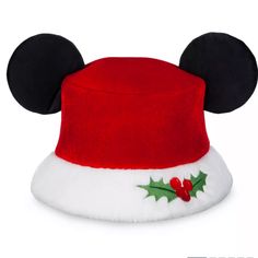 a mickey mouse hat with holly berries on it