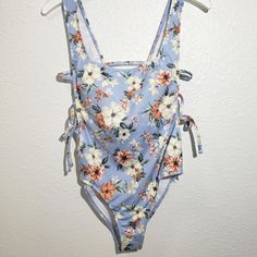 Hurley Floral One Piece Swimsuit Side Tie Built In Shelf Bra With Removable Padding. Light Blue Floral Print Swimwear For Summer, Light Blue Floral Print Swimwear For Spring, Light Blue Sleeveless Swimwear For Spring, Floral One Piece Swimsuit, Built In Shelf, Floral One Piece, Floral Swimsuit, Built In Shelves, Shelf Bra