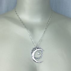 "Sterling silver Celestial Sun, Moon and Star necklace accented with a Swarovski Crystal of your color choice set in a crown bezel setting. All pieces dangle and are independent of each other. The Moon pendant is hand hammered and 1 3/8\" long. All jewelry parts are 925 solid sterling silver. Send jewelry gifts direct with free gift box and note. Available in 16\", 17\", 18\" (model shown), 20\" and 22\" Jan - Garnet Feb - Amethyst March - Aquamarine April - Diamond May - Emerald June - Alexandr Celestial Silver Crystal Necklace As Gift, Celestial Silver Crystal Necklaces For Jewelry Making, Silver Celestial Crystal Necklaces For Jewelry Making, Silver Celestial Crystal Necklace With Moon Charm, Celestial Silver Moon Crystal Necklace, Moon-shaped Sterling Silver Crystal Necklace, Spiritual Silver Moon Charm Necklace, Silver Moon-shaped Sterling Silver Crystal Necklace, Silver Sterling Silver Moon Crystal Necklace