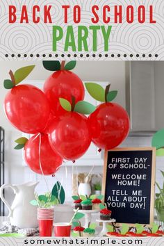 an apple themed back to school party with red balloons and green leaves on the table