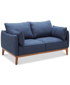 a blue couch sitting on top of a wooden frame