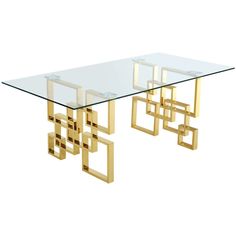 a glass table with gold metal legs and an abstract design on the top, against a white background