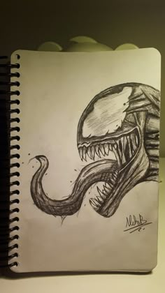 a drawing of an alien head with sharp teeth