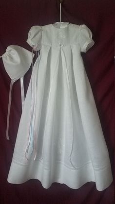 "Gorgeous Irish linen with embroidered Celtic cross with shamrock details highlight this unisex christening gown with matching hat. Available in short or long sleeves. Pintucking detail accents the sleeves, hemline and front yoke with clover cross embroidery. The back yoke has a double row of buttons to adjust the size and the pleated skirt portion of the gown is open down the back for easier diaper changings and the ability to spread the gown out fully for beautiful portraits. Approximate finis Cross Embroidery, Beautiful Portraits, Baby Dedication, Christening Gown, Gown Pattern, Heirloom Sewing, Matching Hat, Christening Gowns, Unisex Baby Clothes