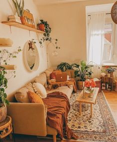 a living room filled with lots of furniture and plants on top of the walls,