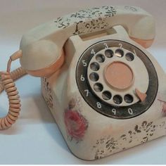 an old fashioned phone is sitting on the table