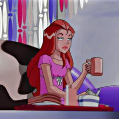 the little mermaid is drinking from a mug