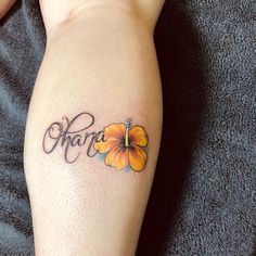 a person with a tattoo on their leg that says mama and has flowers in the middle