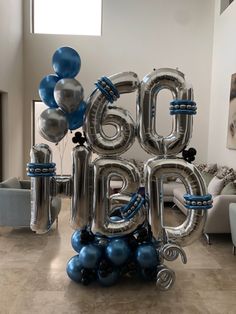 the balloon letters are silver and blue