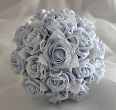 a bridal bouquet made up of blue roses