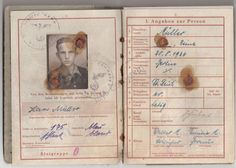 an old german passport with some writing on it's front and back pages,