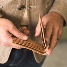 Our Bi-fold Wallet is a best-selling favorite for its classic design and durable, full-grain leather construction. It will only get better with time as the natural oils from his hands add unique character and a beautiful patina finish. Thanks to the strong fibers of full-grain leather, he'll be enjoying this timeless style for years to come. Black Classic Trifold Wallet, Classic Leather Trifold Wallet Hand-stitched, Black Leather Bifold Wallet, Luxury Leather-lined Trifold Wallet For Business, Brown Leather-lined Trifold Wallet, People Around The World, Natural Oils, Full Grain Leather, Leather Wallet