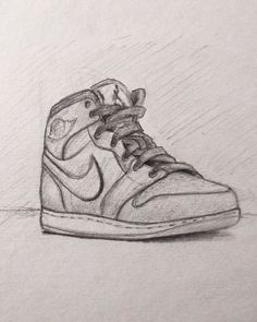 a drawing of a pair of shoes on a sheet of paper with the shoe drawn in pencil