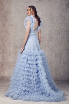 Looking for a unique and eye-catching dress? Look no further than the Ziad Germanos WA0122 Blue Tulle dress! This gorgeous dress is perfect for making a statement at any special event. The delicate tulle fabric is adorned with beautiful sequins that catch the light and sparkle as you move. With a flattering fit and flared skirt, this dress is sure to turn heads wherever you go. Luxury Ruffled Prom Gown, Luxury Ruffled Evening Dress For Prom, Formal Tulle Dress With Ruffled Skirt, Evening Gown With Ruffled Tulle Skirt, Blue Tulle Dress, Blue Tulle, Tulle Fabric, Flared Skirt, Tulle Dress