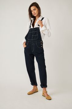 So essential and forever timeless, these special denim overalls from Free People's We The Free collection are featured in a relaxed, slouchy silhouette with tapered legs and exaggerated pocket detail for added dimension. Note: Size and placement of distressing may vary slightly. 100% Cotton Machine wash cold Measurements for size small Inseam: 29.5 in Hips: 41.5 in Rise: 11.5 in Waist: 34 in Black Denim Overalls, Denim Overalls, Pocket Detail, Black Media, Tapered Legs, American Style, Trend Setter, Black Denim, Childrens Clothes