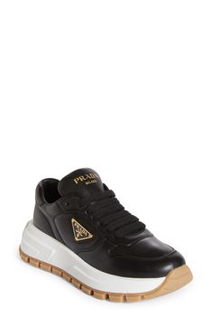 Prada's iconic triangle logo brands the sidewall of this court-inspired sneaker featuring a mixed-media upper set in a cupsole with triangular tread. Lace-up style Leather and textile upper and lining/synthetic sole Made in Italy Designer Shoes Black Calf Leather Sneakers With Logo, Prada Triangle, Triangle Logo, Up Styles, Logo Branding, Designer Shoes, Womens Sneakers, Prada, Mixed Media