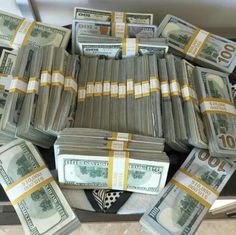 many bundles of money are stacked on top of each other