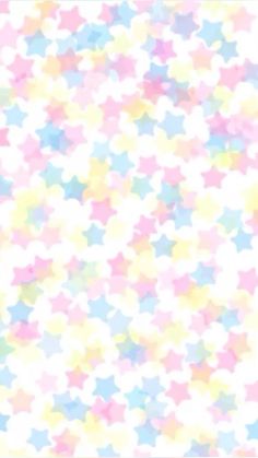 an abstract background with pastel colored stars