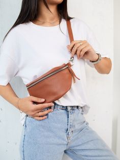 DIMENSIONS BAG M * Width: 22 cm | 8.6 inch * Height: 13 cm | 5.1 inch * Depth: 6 cm | 2.4 inch DIMENSIONS BAG XL * Width: 27 cm | 10.6 inch * Height: 17 cm | 6.7 inch * Depth: 7 cm | 2.7 inch This leather hip bag is perfect for traveling or just to carry in your everyday bag. The personalized fanny pack will help you to keep all necessary staff like phone, wallet, cards, face mask in one place during the day. You can wear it as a belt bag or like a fanny pack or crossbody bag - it's up to your m Casual Leather Pouch With Zipper Closure, Trendy Leather Zipper Pouch Bag, Casual Leather Belt Bag With Zipper Pouch, Brown Pouch Belt Bag With Zipper, Brown Belt Bag With Zipper Pouch, Brown Zipper Pouch Belt Bag For Daily Use, Brown Belt Bag With Zipper Pouch For Daily Use, Brown Crossbody Belt Bag With Zipper Pouch, Brown Crossbody Belt Bag With Zipper