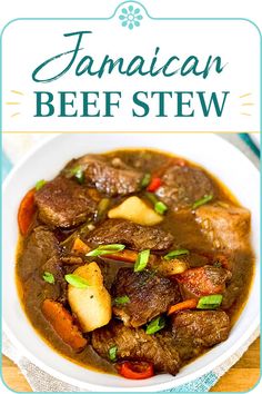 a white bowl filled with beef stew on top of a wooden table