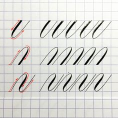 some type of calligraphy that is written in black and red on a sheet of paper