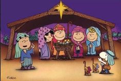 the peanuts gang in front of a christmas nativity scene