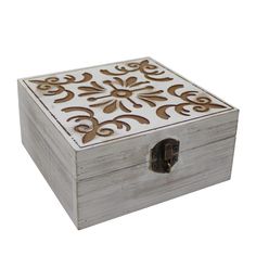 a white box with brown designs on the top and bottom, sitting in front of a white background