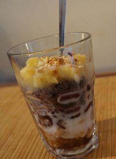 an ice cream sundae in a glass on a table