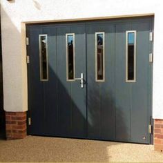 the front door to a house with two windows