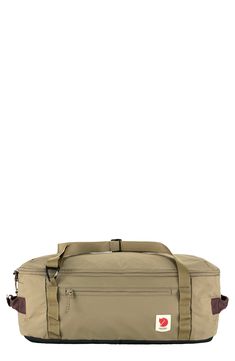 the large duffel bag is beige and brown