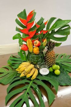 a table topped with lots of different types of fruits and vegetables on top of it