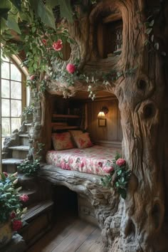 a bed made out of tree trunks with flowers on the bedspread and stairs leading up to it