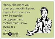 a woman sitting at a desk in front of a sign that says, honey, the more you open your mouth & point fingers, the more your own insec