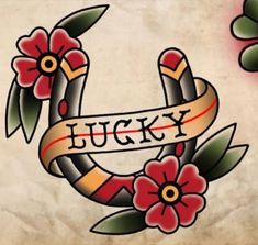 an old school tattoo design with flowers and lucky written on the ribbon in front of it