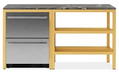 a kitchen island with marble top and two drawers on one side, next to a stainless steel dishwasher