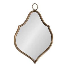 a mirror hanging on the wall with a metal ring around it's edge and an oval shaped frame