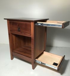 a wooden cabinet with an open drawer