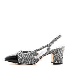 This is an authentic pair of CHANEL Tweed Patent Cap Toe CC Slingback Pumps size 36.5 in Gray. These chic slingback pumps are crafted of grey tweed. They feature a black patent leather cap toe, a 2.75-inch heel, and a slingback strap. 1383787 Tweed Heels, Heels Chanel, Chanel Pumps, Chanel Heels, Chanel Slingback, Grey Pumps, Chanel Tweed, Grey Tweed, Leather Cap