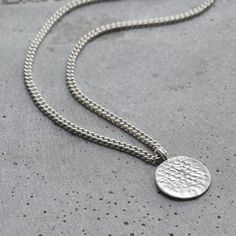 The light catches the fluid molten metal surface texture of this Sterling Silver Men’s Molten Disc Necklace for a stunning effect. The Men’s Molten Disc Necklace is paired with an attractive 20" Sterling Silver curb chain. A perfect, timeless gift.Made from: This necklace is made from 925 sterling silver.Dimensions: Disc is approx 16m Wide. Comes on a 20" thicker curb chain. Each item is individually handmade to order in our Brighton workshop. All of our items are handmade so please check that a Metal Surface Texture, Posh Totty, Molten Metal, Amethyst Tumbled, Mens Items, Metal Surface, Metal Texture, Timeless Gifts, Disc Necklace