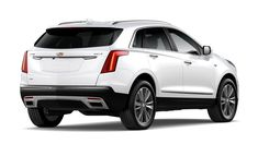 the rear end of a white cadillac suv on a white background with no people in it