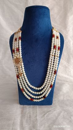 Groom's Necklace This is a must have accessory for the groom in the wedding. The necklace worn over the sherwani gives the groom an excellent look and it is a tradition.                                                                                                                                      Necklace (comes with adjustable Dori/cord) Package: 1 Necklace Material: Pearl & stone beads Care: Store in an airtight plastic bag or box. Keep away from water, moist place & fragrance Elegant White Necklaces For Traditional Ceremonies, Elegant White Necklace For Traditional Ceremonies, Traditional Bridal Long Necklace For Wedding, Traditional Pearl Chain Beaded Necklace For Wedding, Temple Jewelry Style Wedding Mala Long Necklace, Groom Necklace Indian, Traditional Long Beaded Necklaces For Wedding, Temple Jewelry Style Wedding Mala, Elegant Heavy Necklaces For Traditional Ceremonies