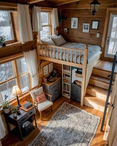 there is a loft bed in the middle of this room with stairs leading up to it