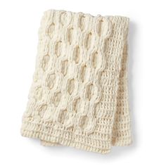 a white knitted blanket on a white background