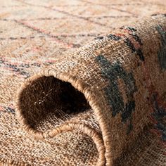 a close up view of an area rug with a hole in the middle on top of it