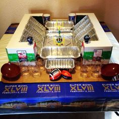 a table topped with lots of plastic containers and bowls next to cups on top of each other