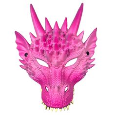 a pink dragon mask with spikes on it's head is seen against a white background