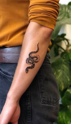 a person with a tattoo on their arm